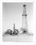 Oil Derricks In Field by Anonymous
