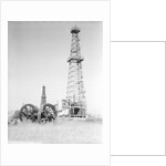 Oil Derricks In Field by Anonymous