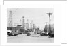 Clusters Of Oil Derricks Along Street by Anonymous