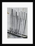 Variety Of Golf Clubs Lean Against Wall by Anonymous