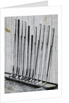 Variety Of Golf Clubs Lean Against Wall by Anonymous