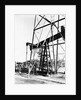 Oil Derrick Pumping Closer Up by Anonymous
