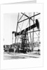 Oil Derrick Pumping Closer Up by Anonymous