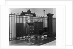 Iron-Grilled Mortgage Window by Anonymous