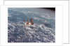 Skylab Space Station in Orbit Over Earth by Anonymous