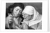 Painting of a Peasant Couple Looking at a Mirror by Jan Massys