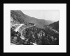 Train Traveling Over Viaduct in Mountain by Anonymous