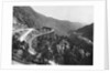 Train Traveling Over Viaduct in Mountain by Anonymous