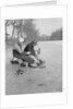 Man Puts Ice Skates On Woman At Rink by Anonymous