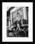 Woman Sitting on Luggage Trolley by Anonymous