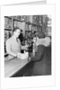 Woman and Grocer by Anonymous