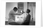 Doctor Examining Boy Patient by Anonymous