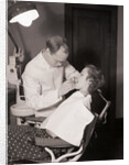 Dentist Examining Patients Teeth by Anonymous