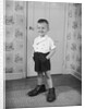 Boy Standing in Oversized Shoes by Anonymous