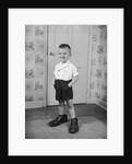 Boy Standing in Oversized Shoes by Anonymous