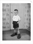 Boy Standing in Oversized Shoes by Anonymous