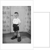 Boy Standing in Oversized Shoes by Anonymous