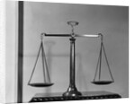 Balancing Scales On Table by Anonymous