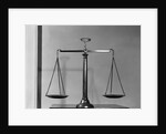 Balancing Scales On Table by Anonymous