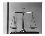 Balancing Scales On Table by Anonymous