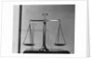 Balancing Scales On Table by Anonymous