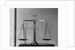 Balancing Scales On Table by Anonymous