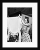 Woman Hanging Laundry Out to Dry by Anonymous