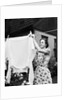 Woman Hanging Laundry Out to Dry by Anonymous