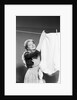 Woman Hanging Laundry by Anonymous