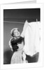 Woman Hanging Laundry by Anonymous