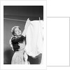 Woman Hanging Laundry by Anonymous