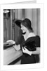 Young Woman At Bank Teller'S Window by Anonymous