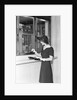 Woman At Bank Teller Window by Anonymous