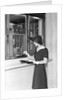 Woman At Bank Teller Window by Anonymous