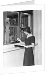 Woman At Bank Teller Window by Anonymous