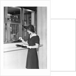 Woman At Bank Teller Window by Anonymous