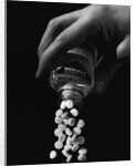 Hand Pouring Aspirin from Bottle by Anonymous