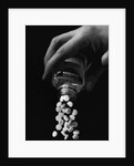 Hand Pouring Aspirin from Bottle by Anonymous