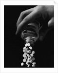 Hand Pouring Aspirin from Bottle by Anonymous