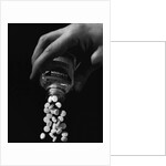 Hand Pouring Aspirin from Bottle by Anonymous