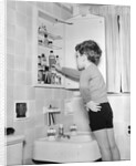 Boy Reaching into Medicine Cabinet by Anonymous