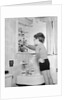 Boy Reaching into Medicine Cabinet by Anonymous