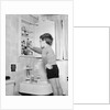 Boy Reaching into Medicine Cabinet by Anonymous