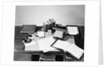 Desk Covered with Assorted Office Supplies by Anonymous