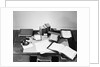 Desk Covered with Assorted Office Supplies by Anonymous