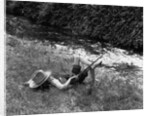Boy Fishing with Hat Over Face by Anonymous