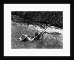 Boy Fishing with Hat Over Face by Anonymous