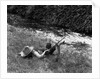 Boy Fishing with Hat Over Face by Anonymous