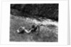 Boy Fishing with Hat Over Face by Anonymous