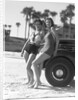 Women in Bathing Suits Leaning Against Car by Anonymous